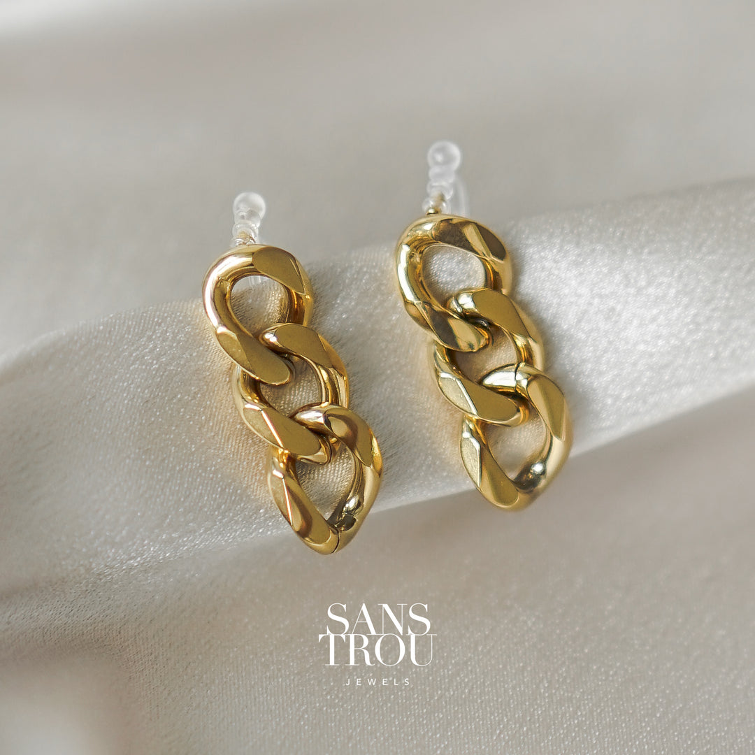 Sans Trou 18k gold plated clip-on earring with a drop chain style.  