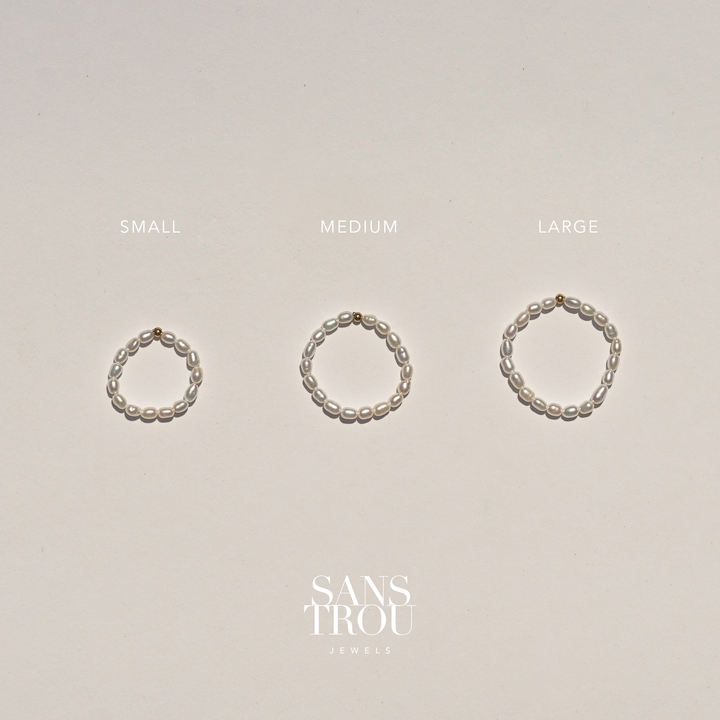 Three pearl rings of different sizes labeled 'Small', 'Medium', and 'Large' on a beige background with 'Sans Trou Jewels' branding.