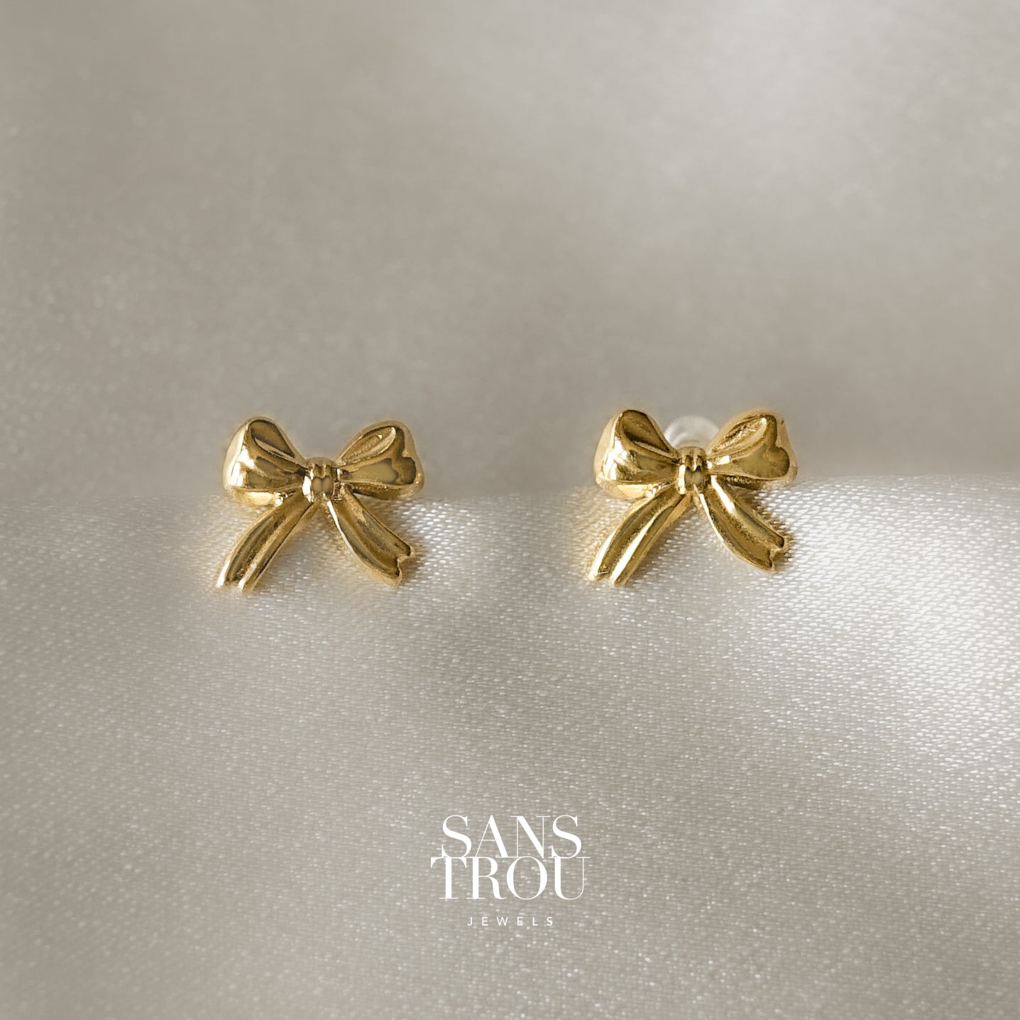 Gold bow clip-on stud earrings