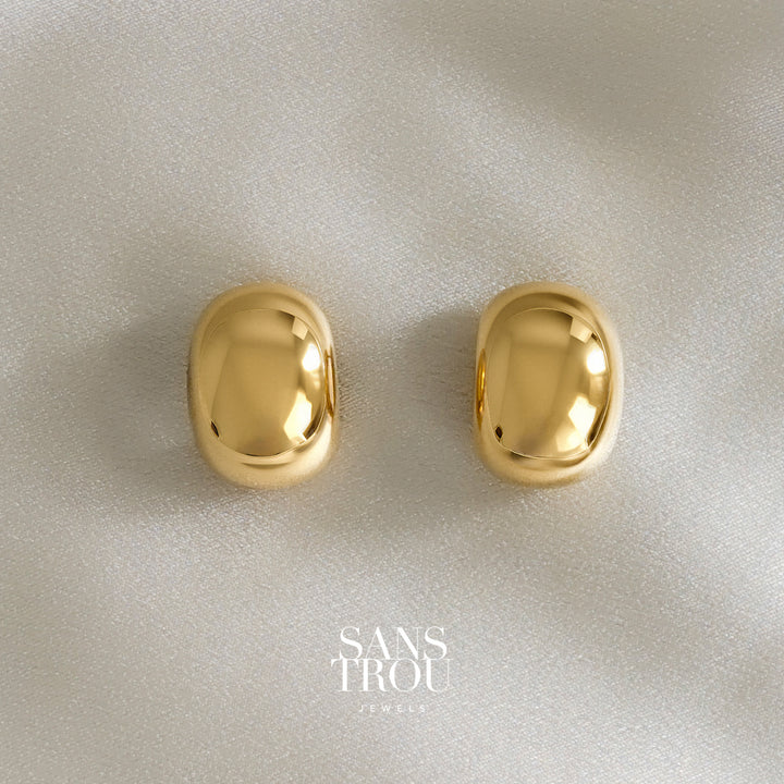 Pair of gold dome/ bean shaped clip-on earrings with reflective mirrored surface