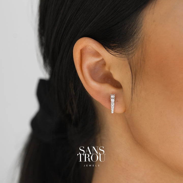 Model wearing sterling silver stud clip-ons with CZ stones. 