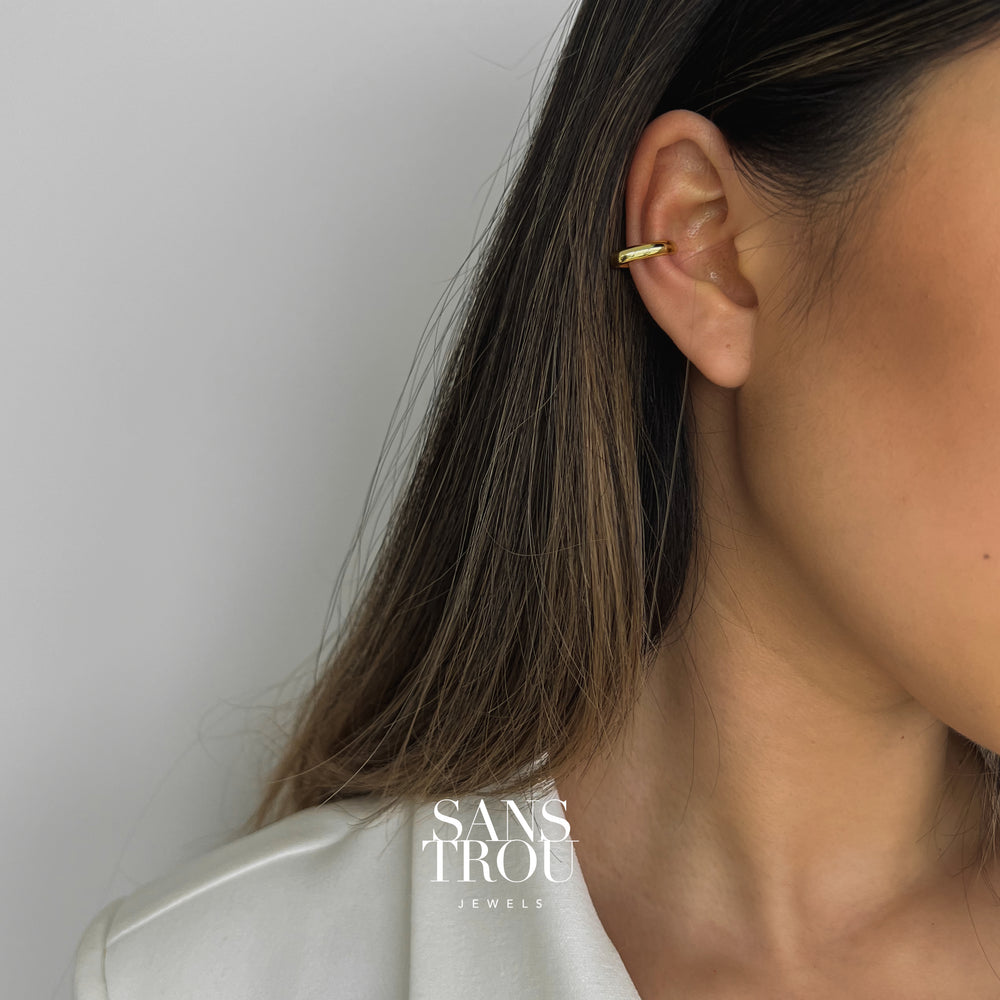 Model wearing a 18k gold plated rectangular ear cuff designed for the conch. 
