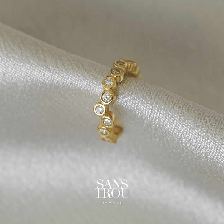 Sans Trou 18k gold plated conch ear cuff with CZ stones in an asymmetrical arrangement.  