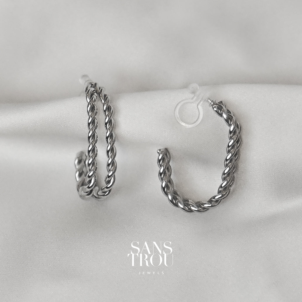 Sans Trou silver clip-on earrings made with two twisted rope bars that come together in a half hoop shape