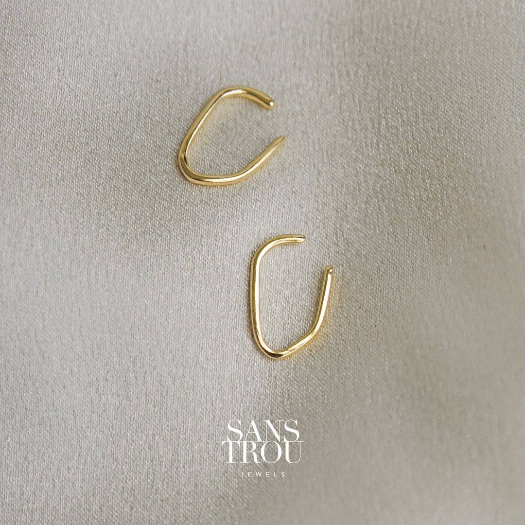  Gold ear cuff set with a slim rectangular design. Designed to wear adjacent or separate on the helix or conch.