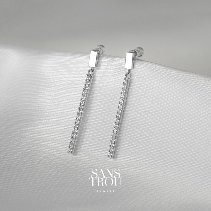 Sans Trou sterling silver drop clip-on earrings featuring a slim bar with CZ stones.