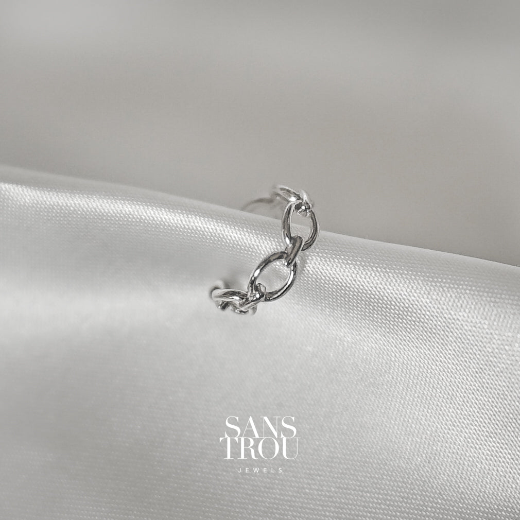 Sans Trou sterling silver ear cuff with a dainty rounded chain pattern. The Clara ear cuff features spheric ends for comfortable wear. 