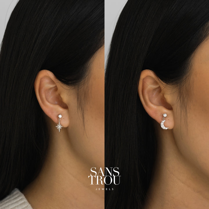 silver star and moon clip-on earrings with cz stones on model's ears