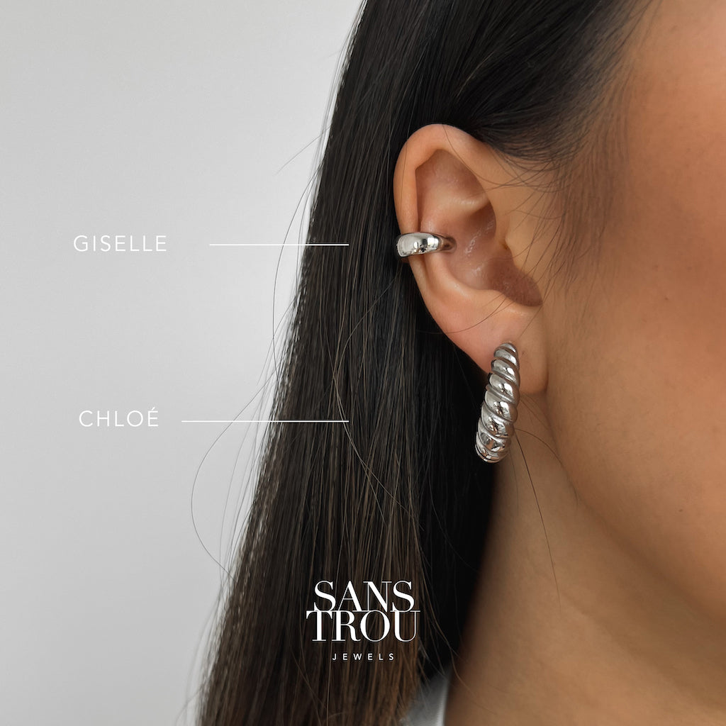 Model wears a sterling silver chunky ear cuff on the cartilage. 