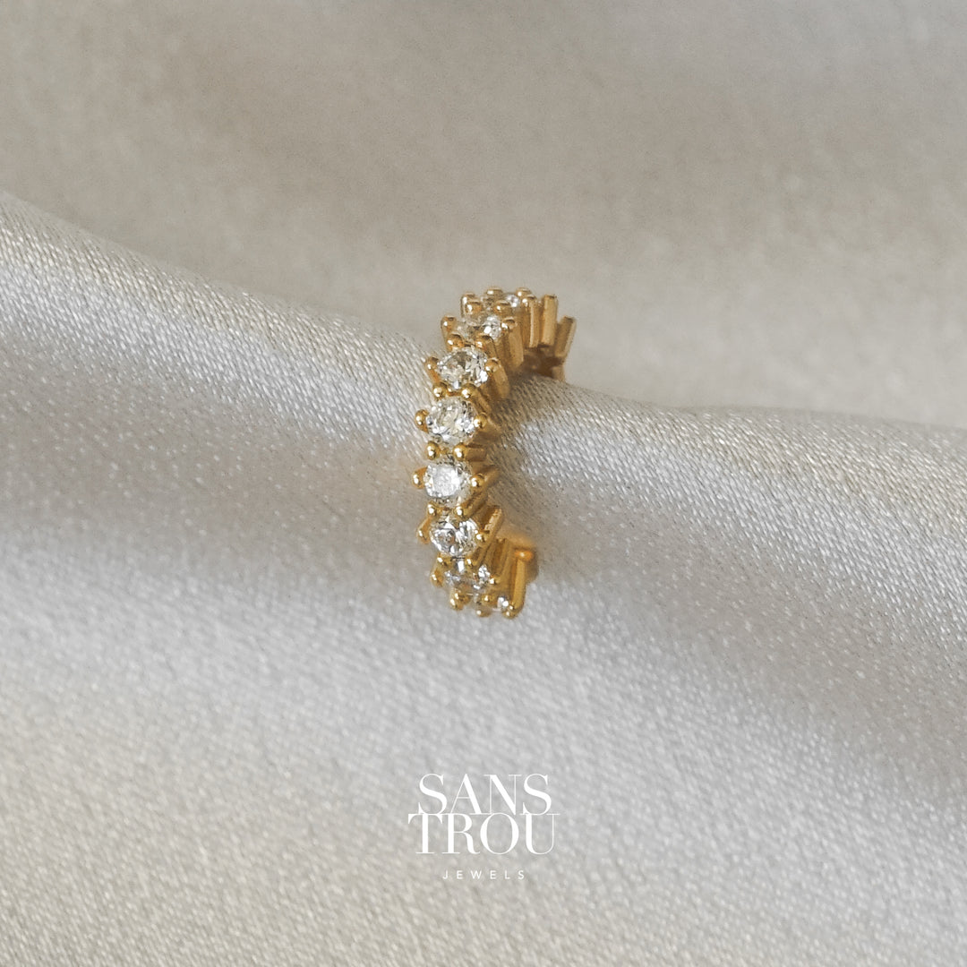Sans Trou 18k gold plated ear cuff with studded CZ stones. This cuff can be worn on the helix. 