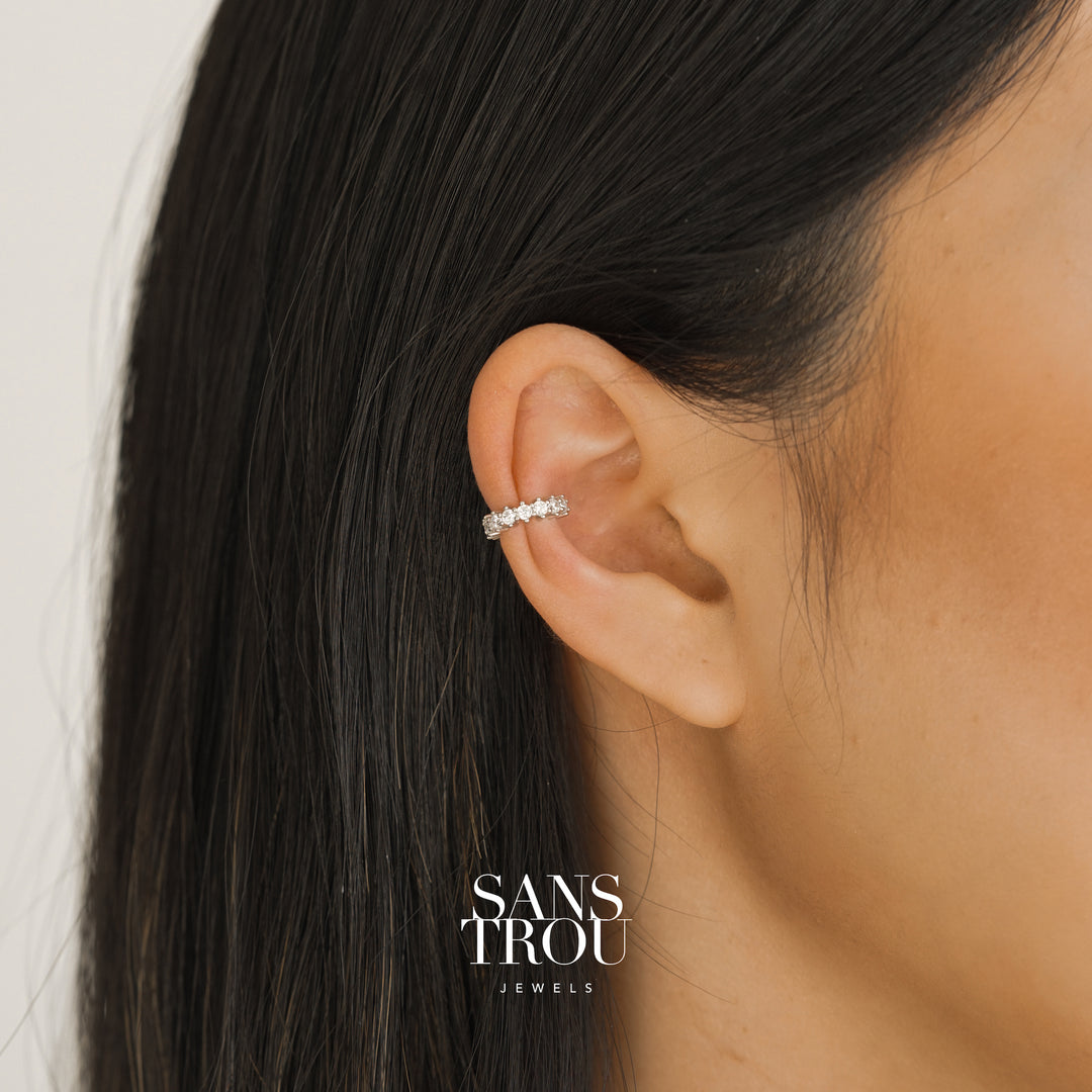 Model wears a sterling silver ear cuff with studded CZ stones on the helix.