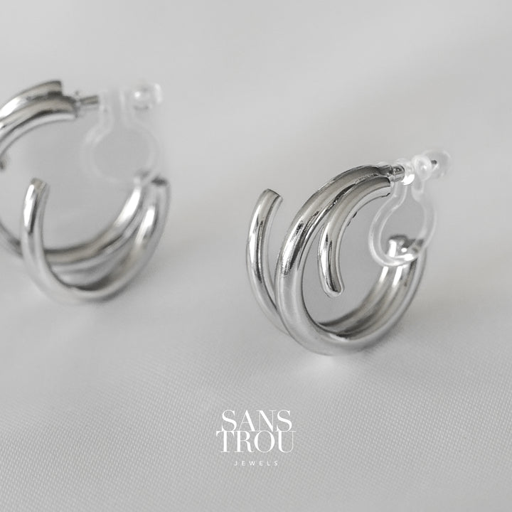 Sans Trou sterling silver spiral clip-on earring. The Liana has an asymmetrical pair and is worn on the lobe