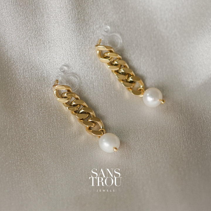 Sans Trou 18k gold plated drop chain clip-on earring with an attached fresh water pearl.  