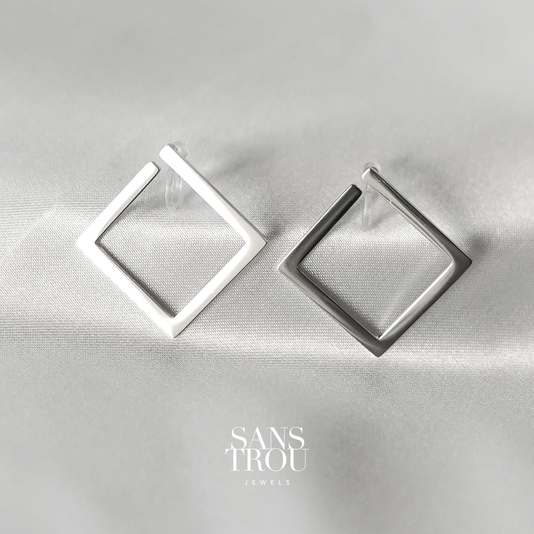 Sans Trou stainless steel silver square clip-on earrings designed for the lobe. The Sara attached to the lobe by a resin clip. 
