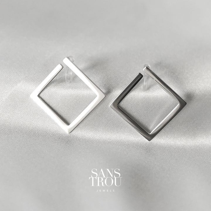 Sans Trou stainless steel silver square clip-on earrings designed for the lobe. The Sara attached to the lobe by a resin clip. 